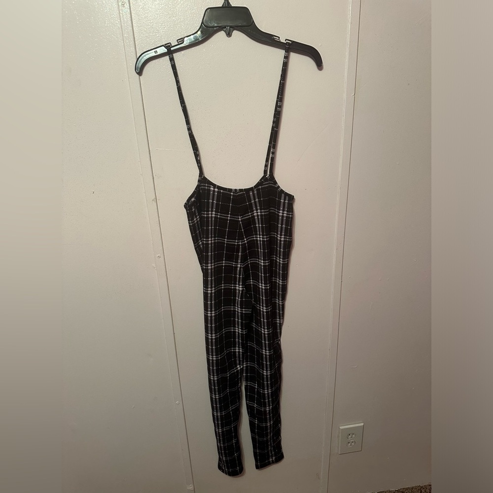 Black and white skinny legged jumpsuit. Size medium